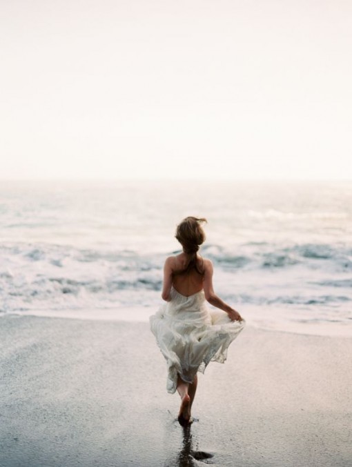 Woman Running Into Water | Covet Living